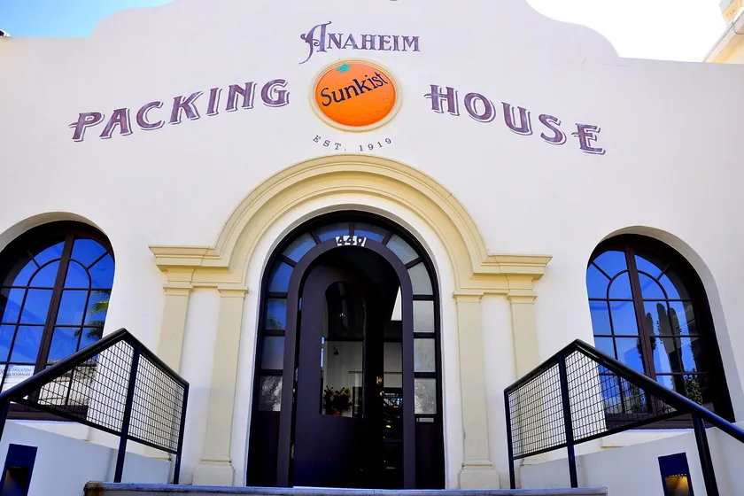 The restored 1919 Anaheim Packing House, its white Mission Revival front marked with the Sunkist orange, in downtown Anaheim