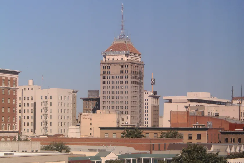 Downtown Fresno's skyline, led by the historic Pacific Southwest Building and its red-tiled crown and spire
